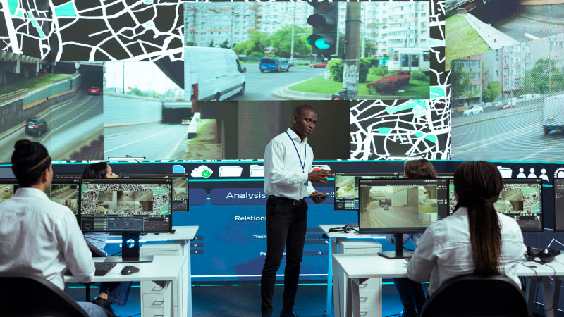 african american manager overseeing monitoring activity control center