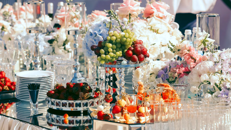 fully secured table by dishes fruits